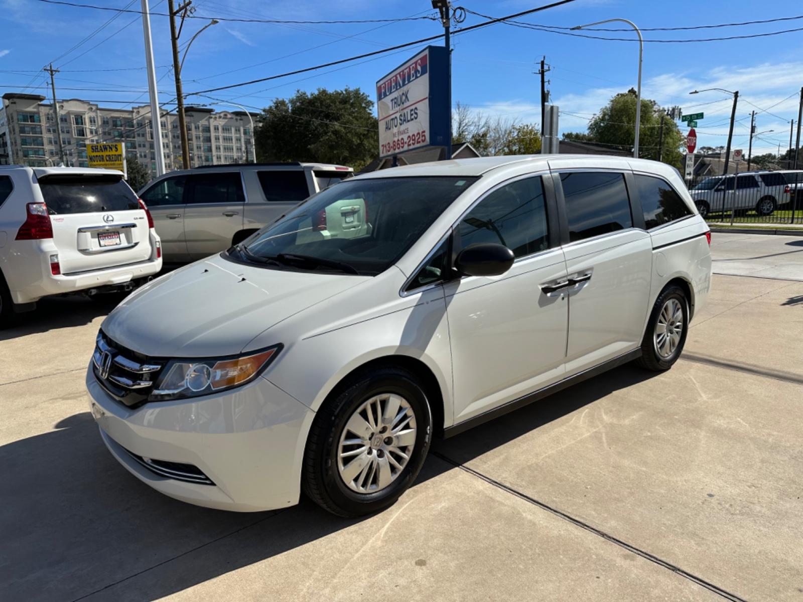 2014 White /Beige Honda Odyssey LX (5FNRL5H29EB) with an 3.5L V6 SOHC 24V engine, 6-Speed Automatic transmission, located at 1501 West 15th St., Houston, 77008, (713) 869-2925, 29.797941, -95.411789 - Photo #0